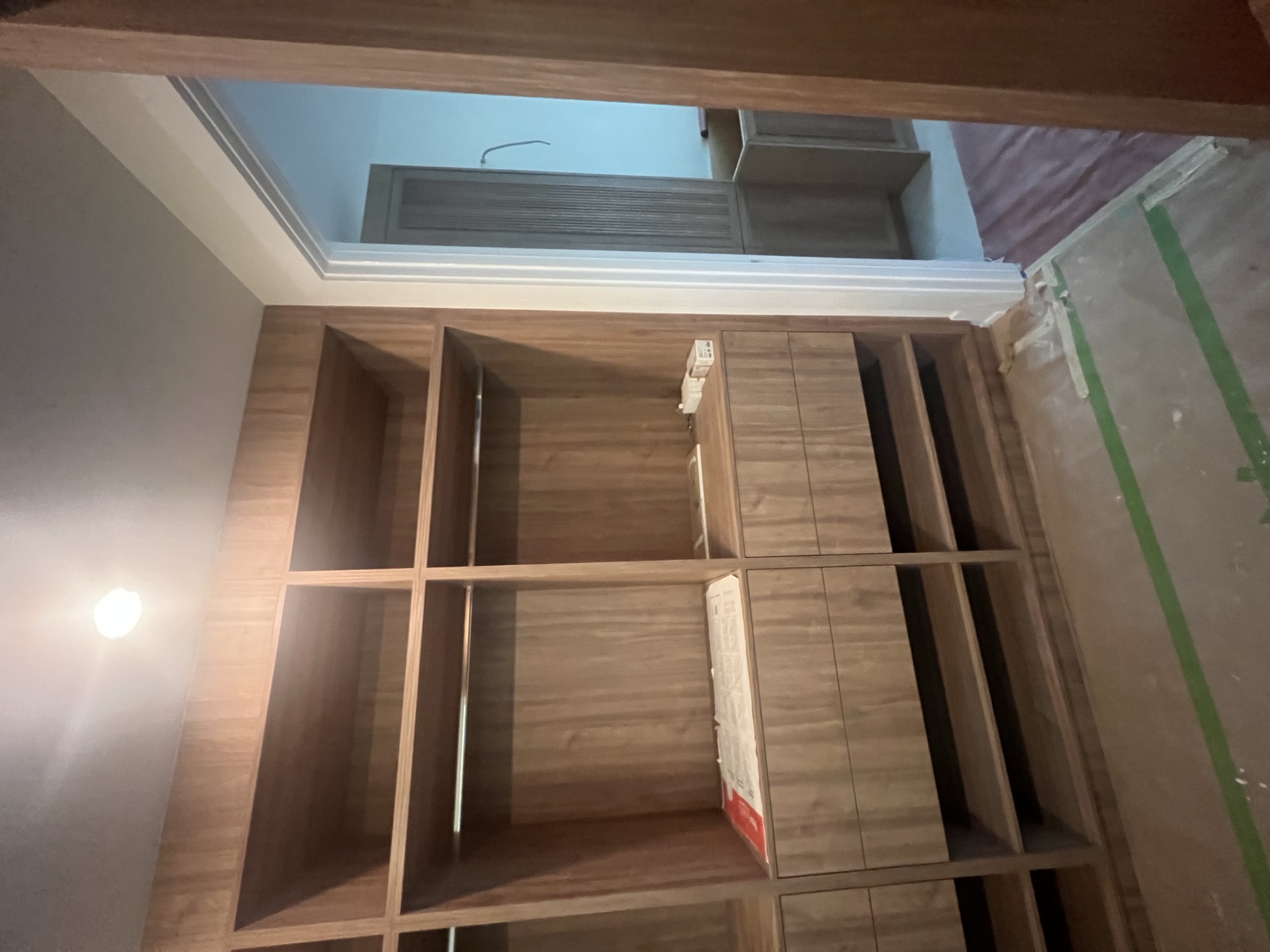 Walnut walk in closet cabinetry