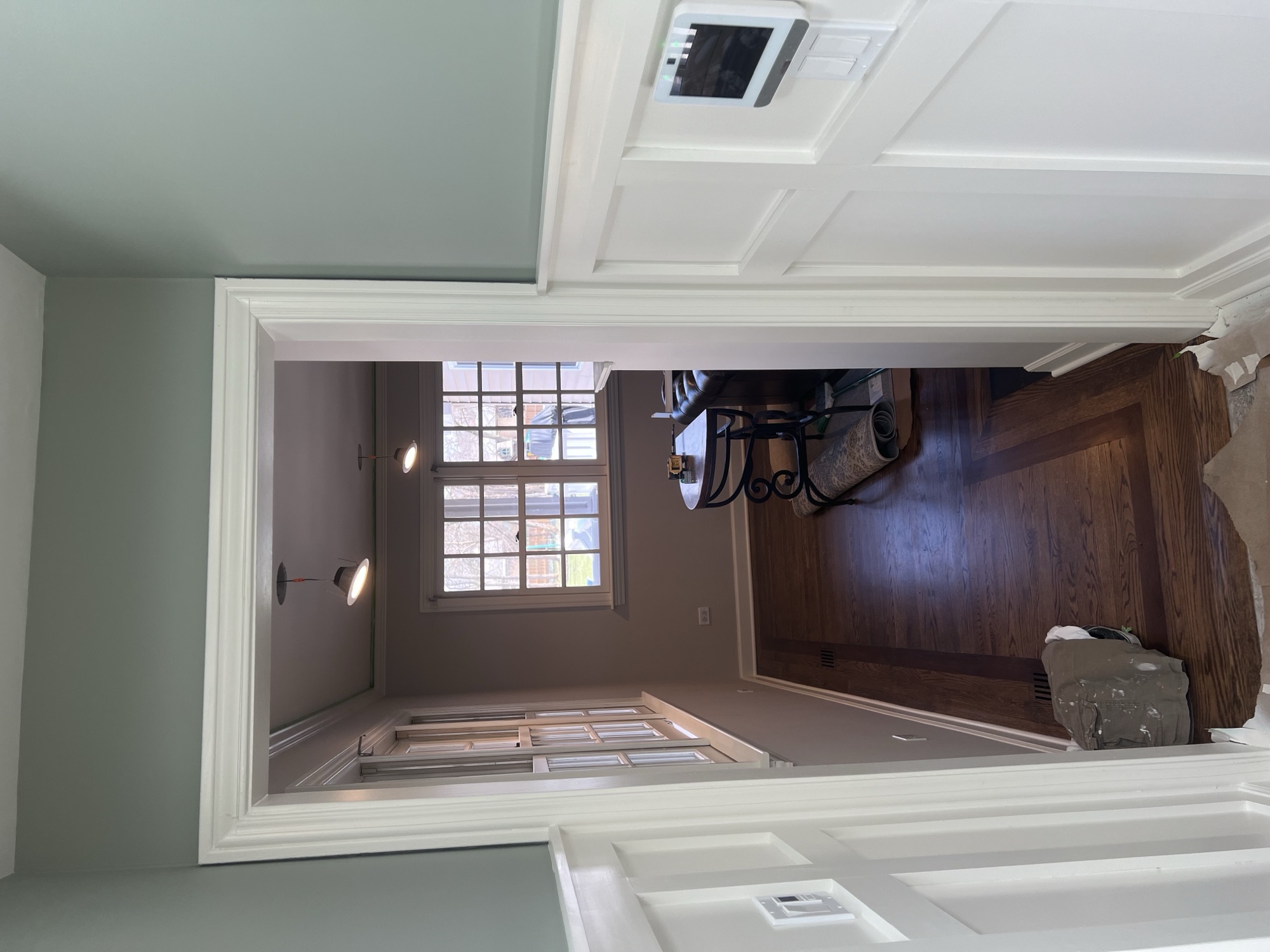 Sage walls white wainscoting hallway