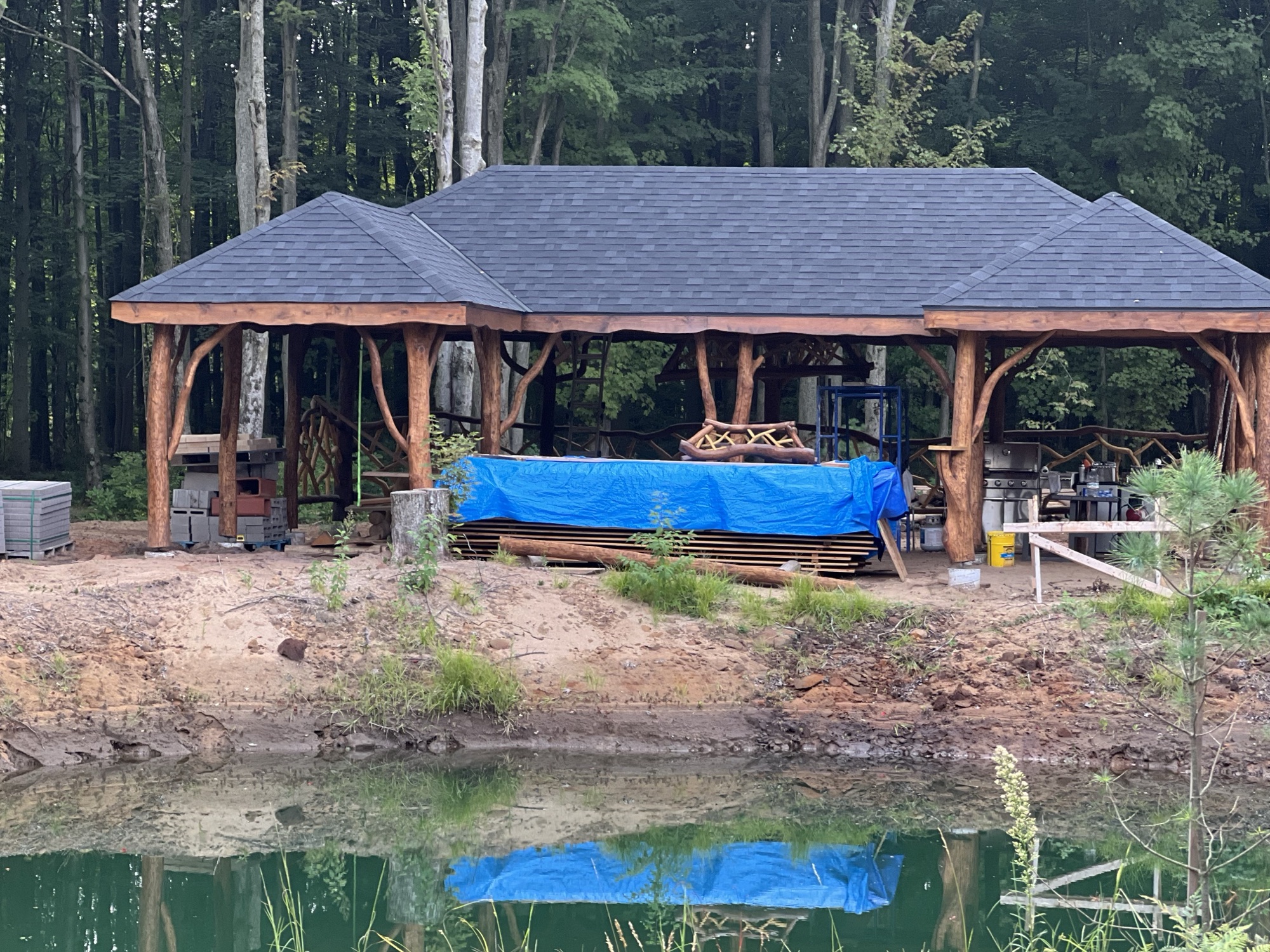 Rustic log pavilion pond